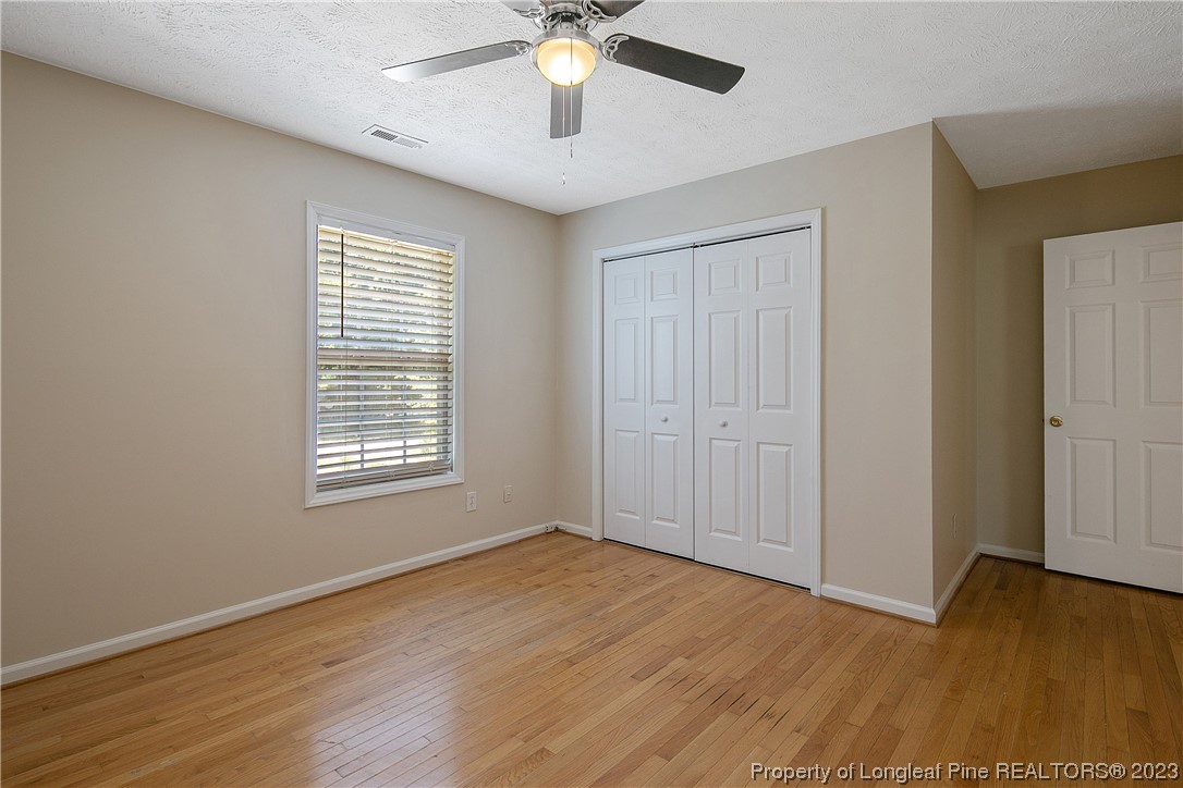 624 Porter Road Hope Mills, NC 28348 - Photo 38 of 45 a view of an empty room with wooden floor and a window