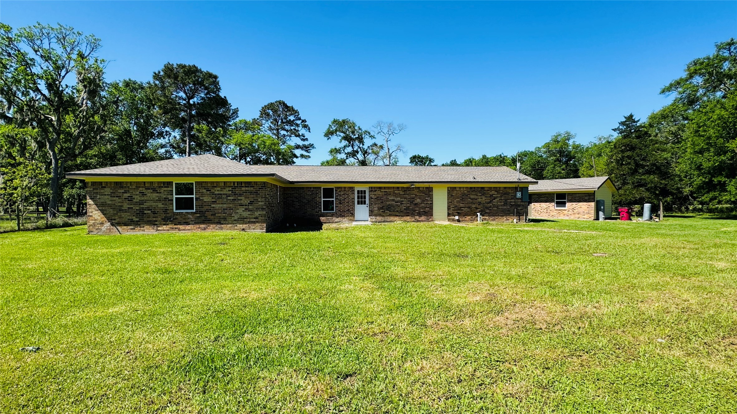 1434 County Road 878A Sweeny, TX 77480 - Photo 9 of 36 a front view of a house with a yard