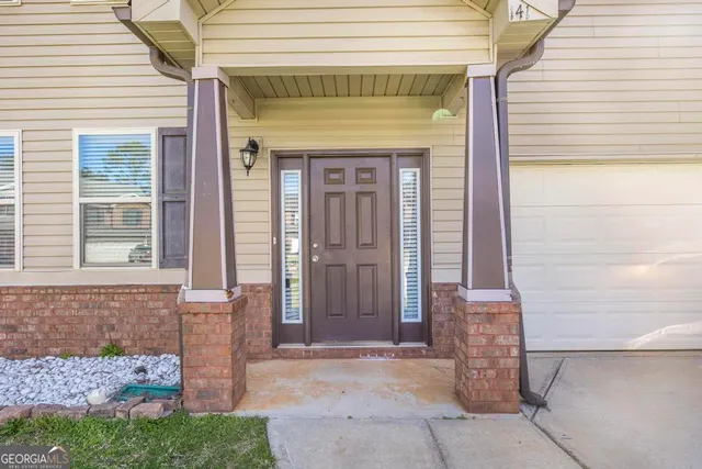 a front view of a house with a porch
