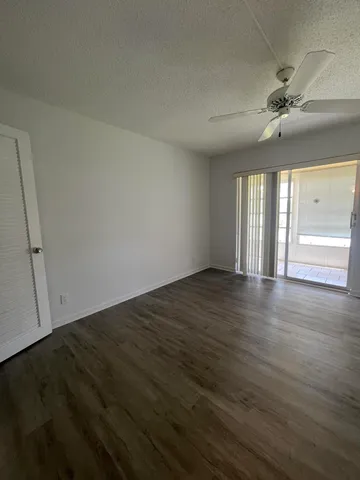 a view of a room with wooden floor