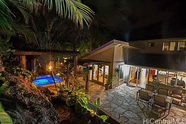 1158 Kaluanui Road Honolulu, HI 96825 - Photo 1 of 1 INCREDIBLE "Hawaiian Mountain Retreat" Backyard Entertainment Area with Living Waterfall, Jacuzzi, Tiki Torches, Hawaiian Flora and Multiple Sitting Areas