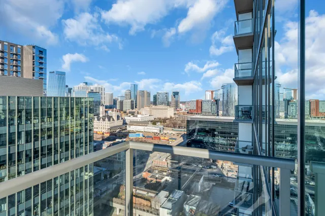 a view of an buildings from the balcony