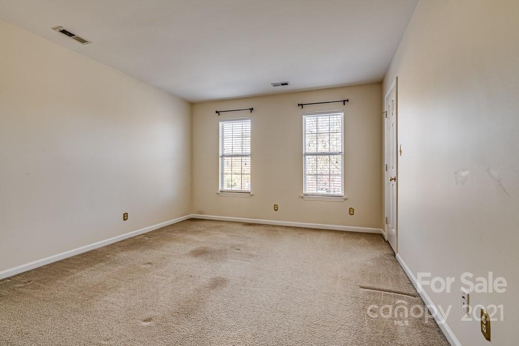 4511 Brownes Ferry Road Charlotte, NC 28269 - Photo 14 of 26 an empty room with windows