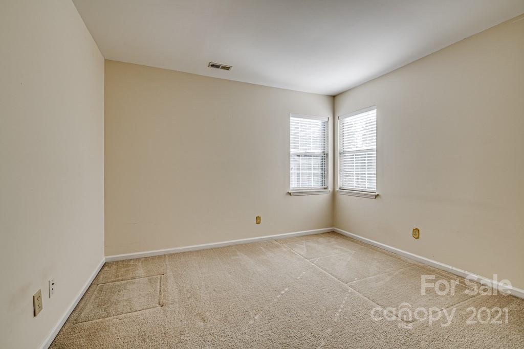 4511 Brownes Ferry Road Charlotte, NC 28269 - Photo 15 of 26 an empty room with windows