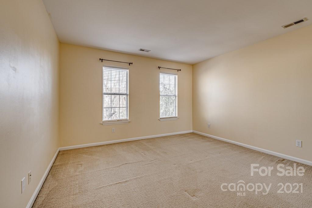 4511 Brownes Ferry Road Charlotte, NC 28269 - Photo 16 of 26 an empty room with windows