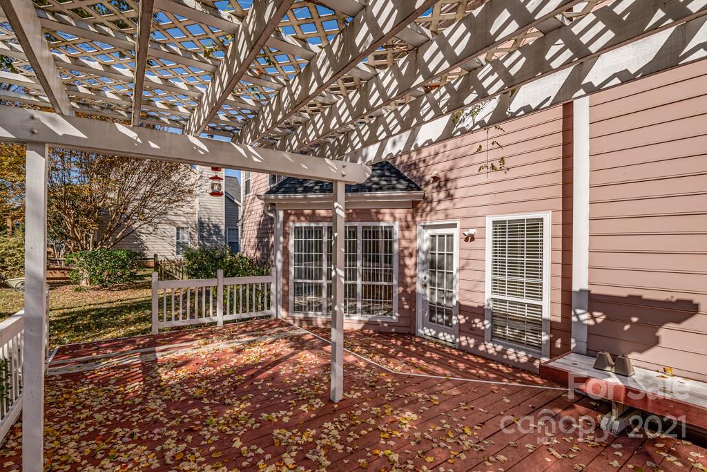 4511 Brownes Ferry Road Charlotte, NC 28269 - Photo 20 of 26 a view of a house with backyard and sitting area
