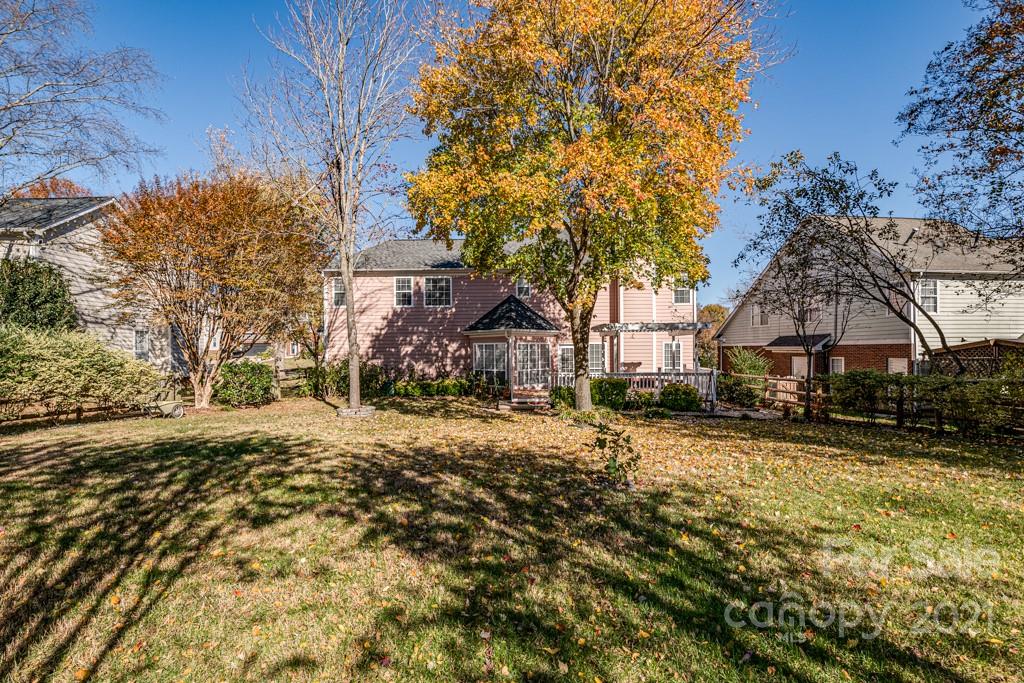 4511 Brownes Ferry Road Charlotte, NC 28269 - Photo 23 of 26 a view of a house with a yard