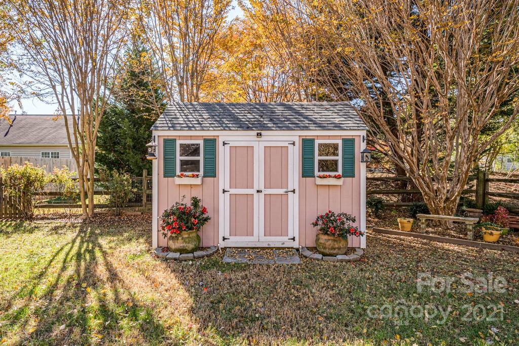 4511 Brownes Ferry Road Charlotte, NC 28269 - Photo 25 of 26 a view of a house with a yard