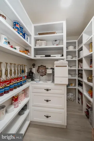 a spacious bathroom with a double vanity sink mirror and a bathtub