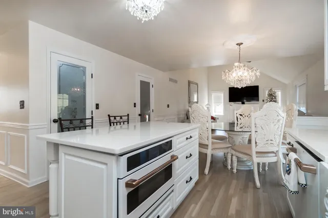 a bathroom with a toilet shower and a mirror