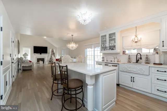 a bathroom with double vanity sinks a vanity two mirror and a window