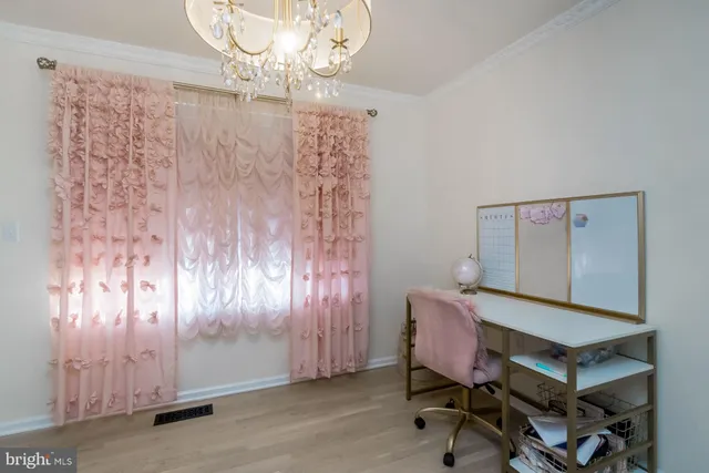 a living room with furniture a rug and a window
