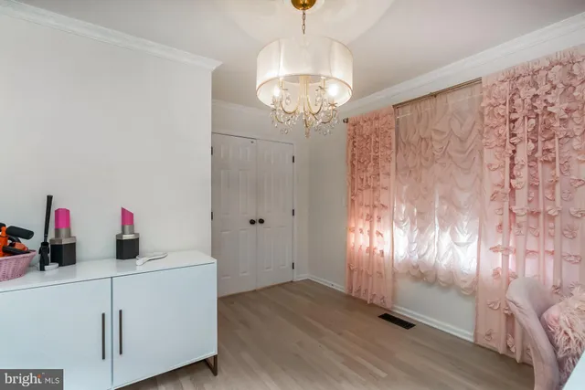 a living room with furniture and a mirror