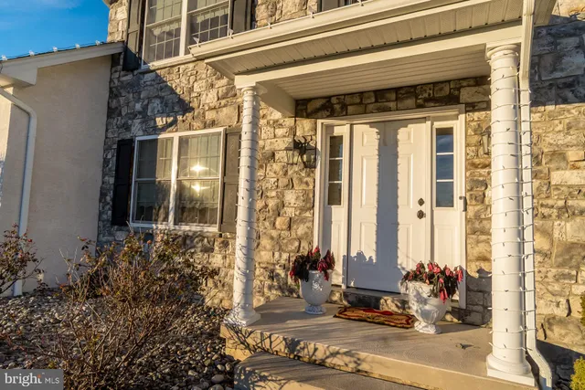 a view of a house with a potted plant