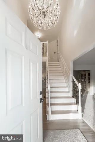 a view of entryway and hall with a front door