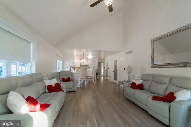 a view of a livingroom with workspace and a window