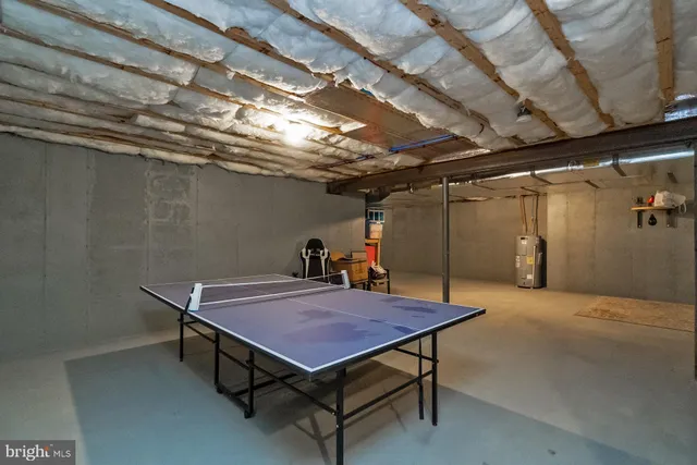 a view of a house with swimming pool and sitting area