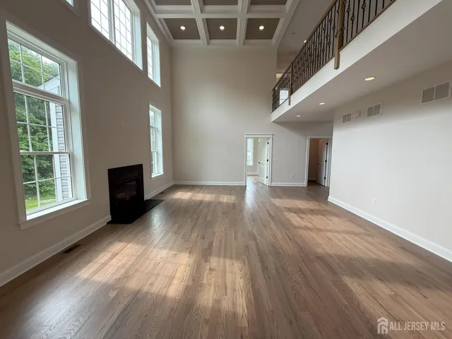 a large kitchen with stainless steel appliances lots of counter space and windows