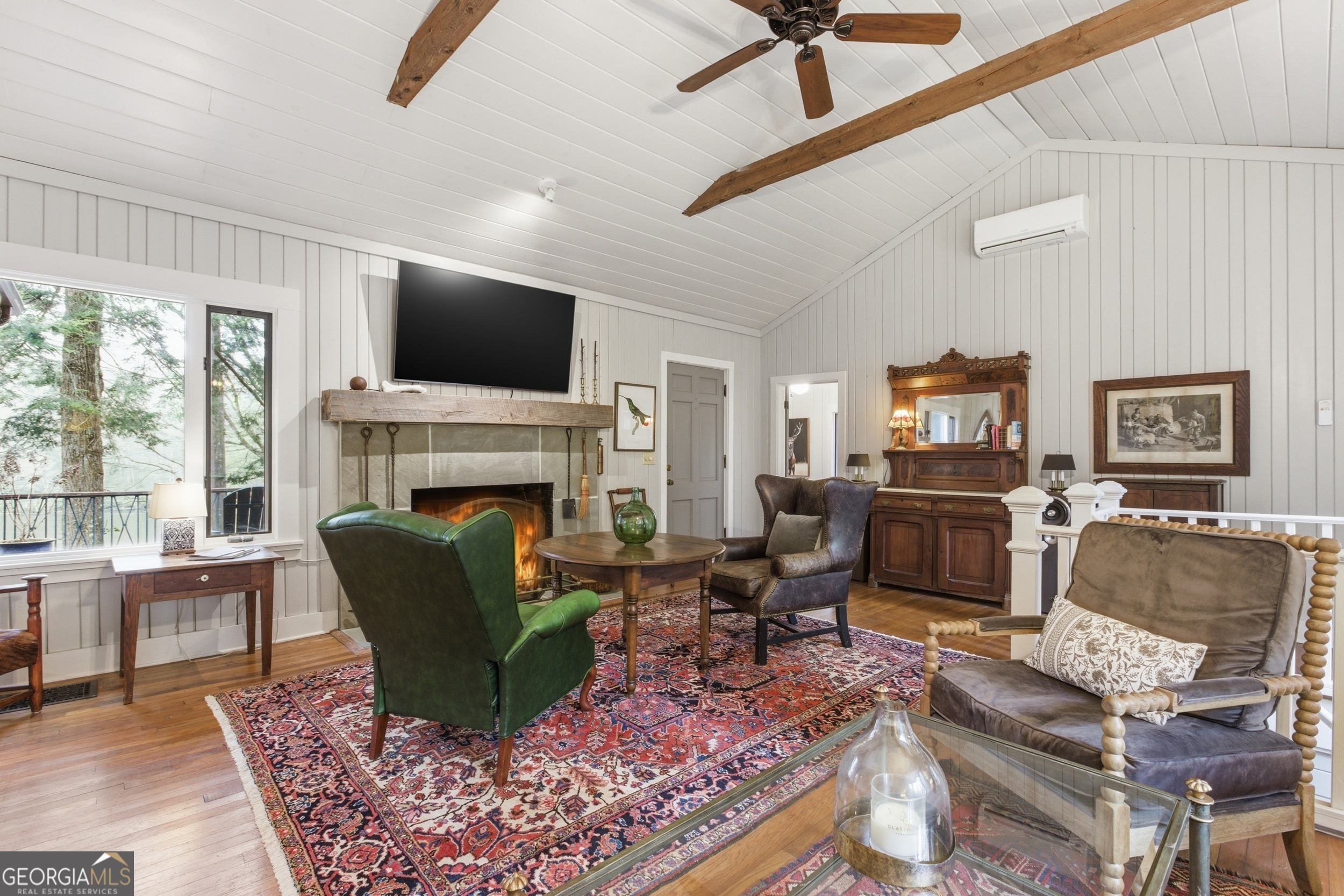 1921 Franklin Road Highlands, NC 28741 - Photo 16 of 72 a living room with furniture a flat screen tv and a fireplace