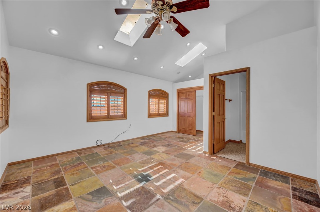 640 North Racetrack Road Henderson, NV 89015 - Photo 42 of 65 Warm wood accents complement the multi-hued tiled flooring in this bright, adaptable living space.