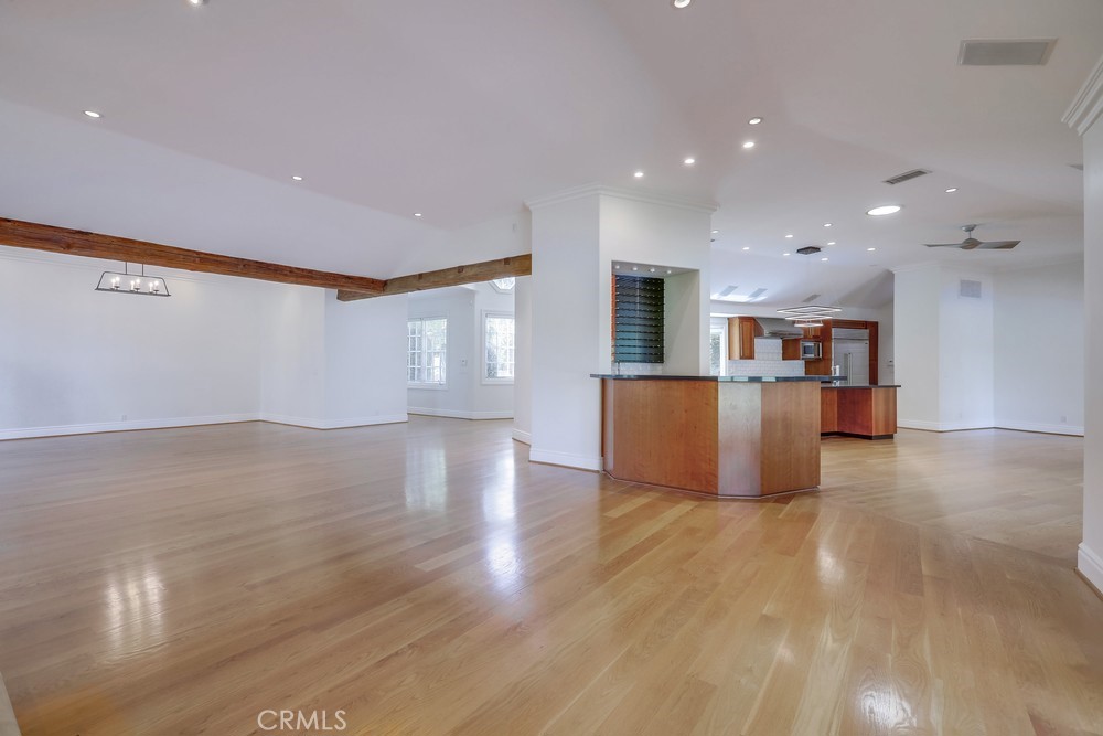 630 West Devon Place Long Beach, CA 90807 - Photo 11 of 49 a view of a big room with wooden floor and a kitchen