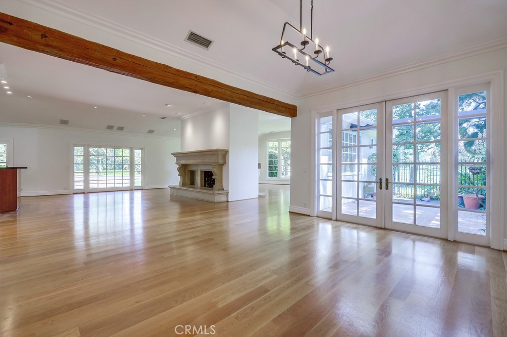 630 West Devon Place Long Beach, CA 90807 - Photo 12 of 49 a view of an empty room with wooden floor and a window