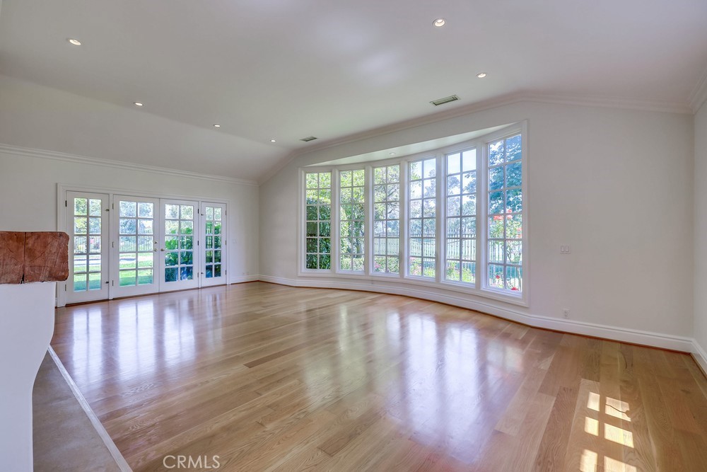 630 West Devon Place Long Beach, CA 90807 - Photo 13 of 49 a view of an empty room with wooden floor and a window