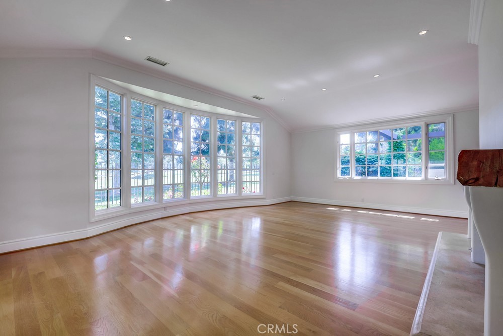 630 West Devon Place Long Beach, CA 90807 - Photo 14 of 49 a view of an empty room with wooden floor and a window