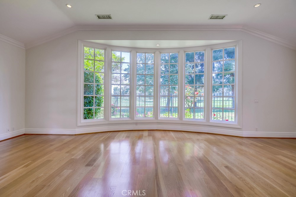 630 West Devon Place Long Beach, CA 90807 - Photo 15 of 49 a view of an empty room with wooden floor and a window