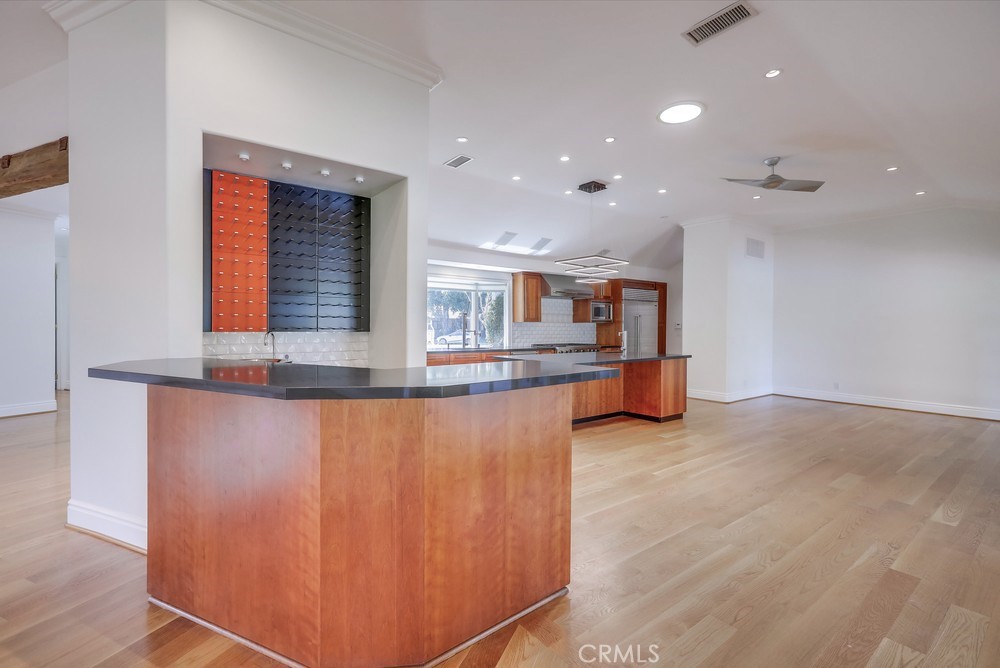 630 West Devon Place Long Beach, CA 90807 - Photo 19 of 49 a kitchen with stainless steel appliances granite countertop a refrigerator and a sink