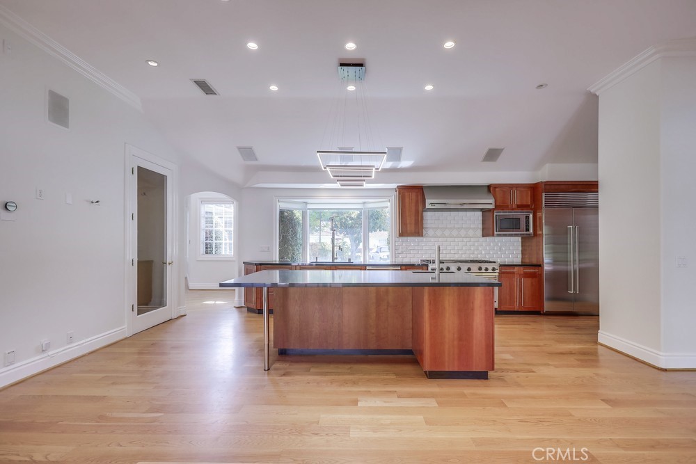 630 West Devon Place Long Beach, CA 90807 - Photo 20 of 49 a kitchen with stainless steel appliances granite countertop a stove a sink and a refrigerator