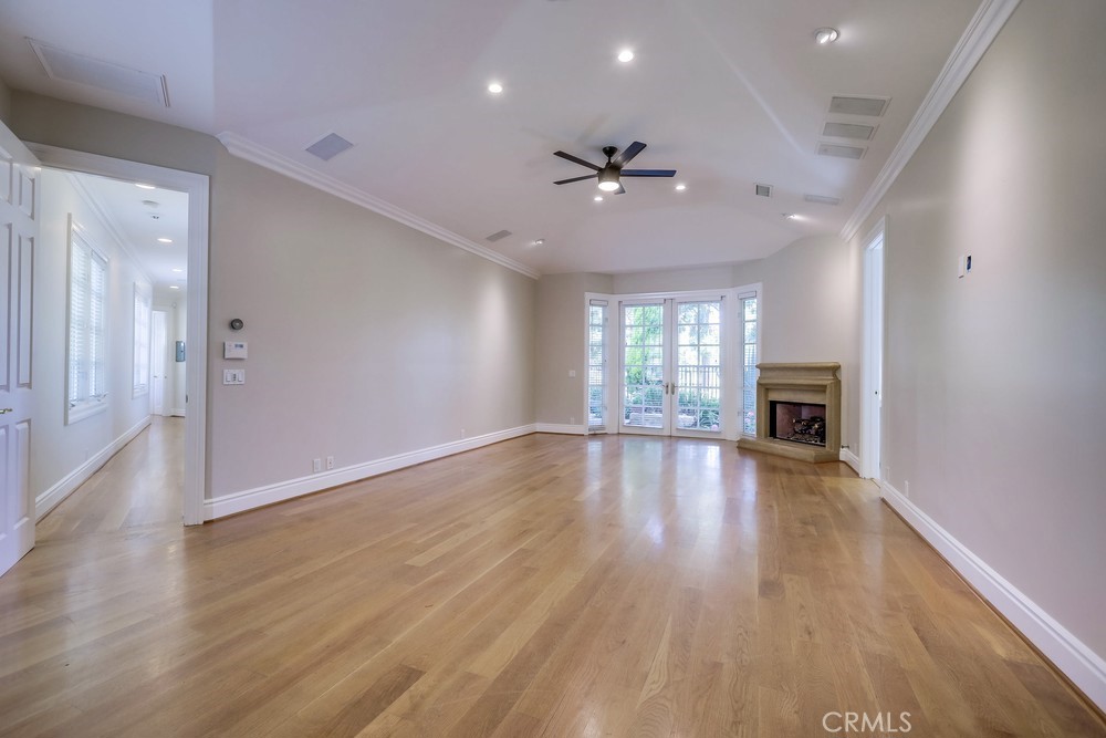 630 West Devon Place Long Beach, CA 90807 - Photo 27 of 49 a view of an empty room with window and wooden floor