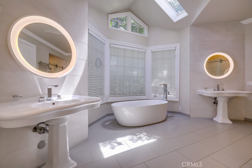 630 West Devon Place Long Beach, CA 90807 - Photo 31 of 49 a bathroom with a sink a toilet and mirror