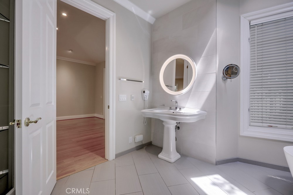 630 West Devon Place Long Beach, CA 90807 - Photo 35 of 49 a bathroom with a sink a toilet and a window