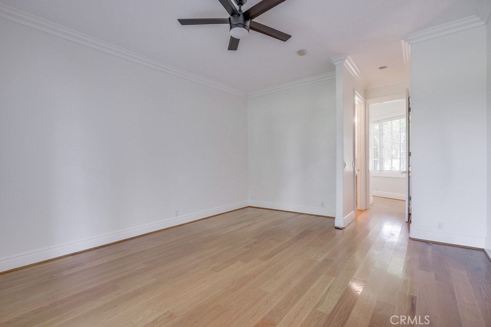 630 West Devon Place Long Beach, CA 90807 - Photo 36 of 49 a view of an empty room with wooden floor and a ceiling fan