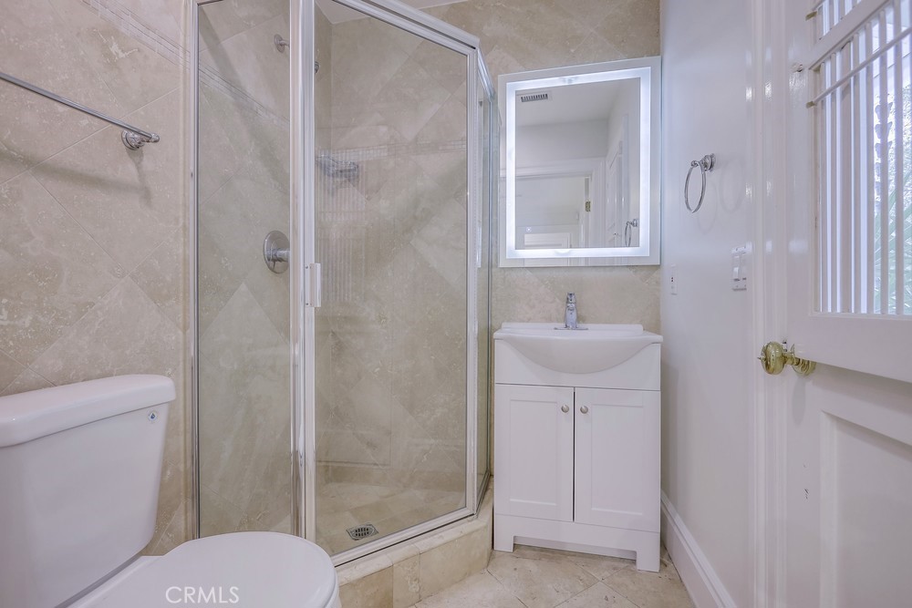 630 West Devon Place Long Beach, CA 90807 - Photo 39 of 49 a bathroom with a sink a toilet and shower
