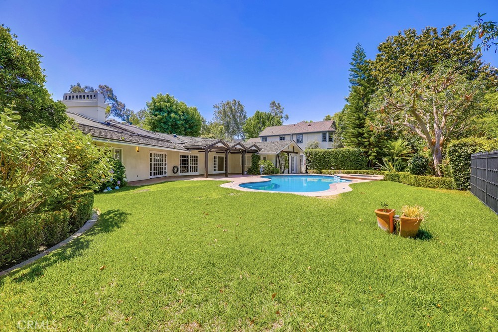 630 West Devon Place Long Beach, CA 90807 - Photo 42 of 49 a view of a house with a yard porch and sitting area
