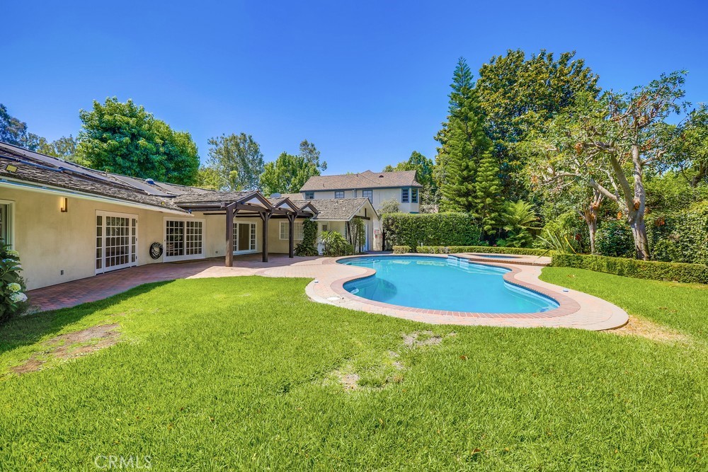 630 West Devon Place Long Beach, CA 90807 - Photo 43 of 49 a view of a house with a swimming pool