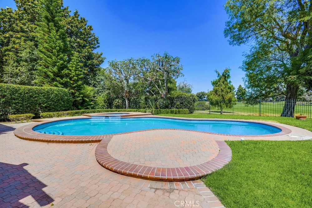 630 West Devon Place Long Beach, CA 90807 - Photo 47 of 49 a view of a swimming pool with a yard