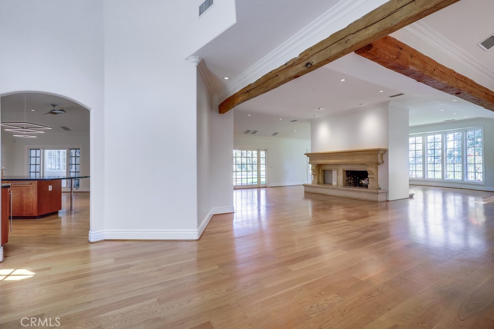 630 West Devon Place Long Beach, CA 90807 - Photo 7 of 49 an entryway and livingroom with fireplace wooden floor and a window