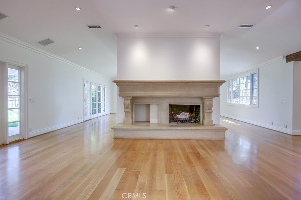 630 West Devon Place Long Beach, CA 90807 - Photo 9 of 49 a view of an empty room with wooden floor fireplace and a window