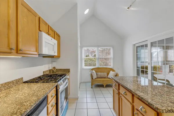 a kitchen that has a sink and a stove