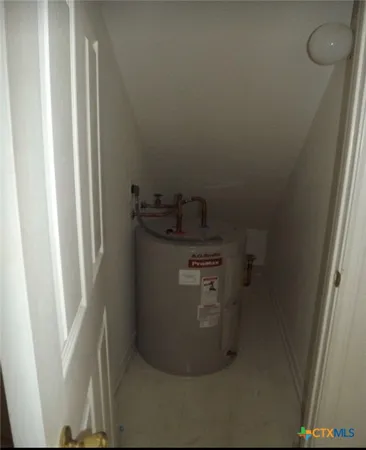 a view of a refrigerator in kitchen