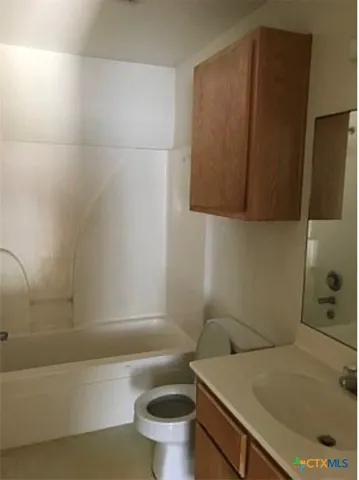 a bathroom with a sink and a toilet