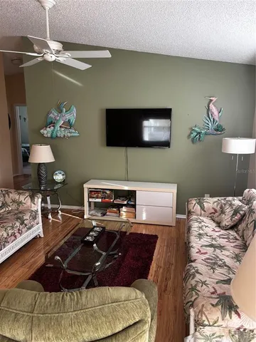 a bed room with a bed window and a flat screen tv