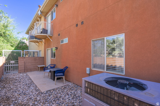 700 North Main Street, Unit F3 Washington, UT 84780 - Photo 28 of 34 Private outdoor patio featuring a concrete slab and surrounding gravel landscaping
