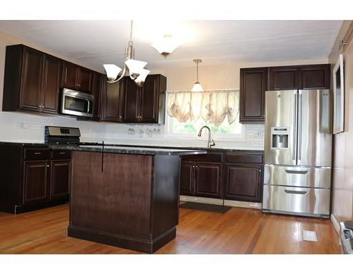 80 Bevier Street Springfield, MA 01107 - Photo 4 of 24 a kitchen with kitchen island granite countertop stainless steel appliances and a sink