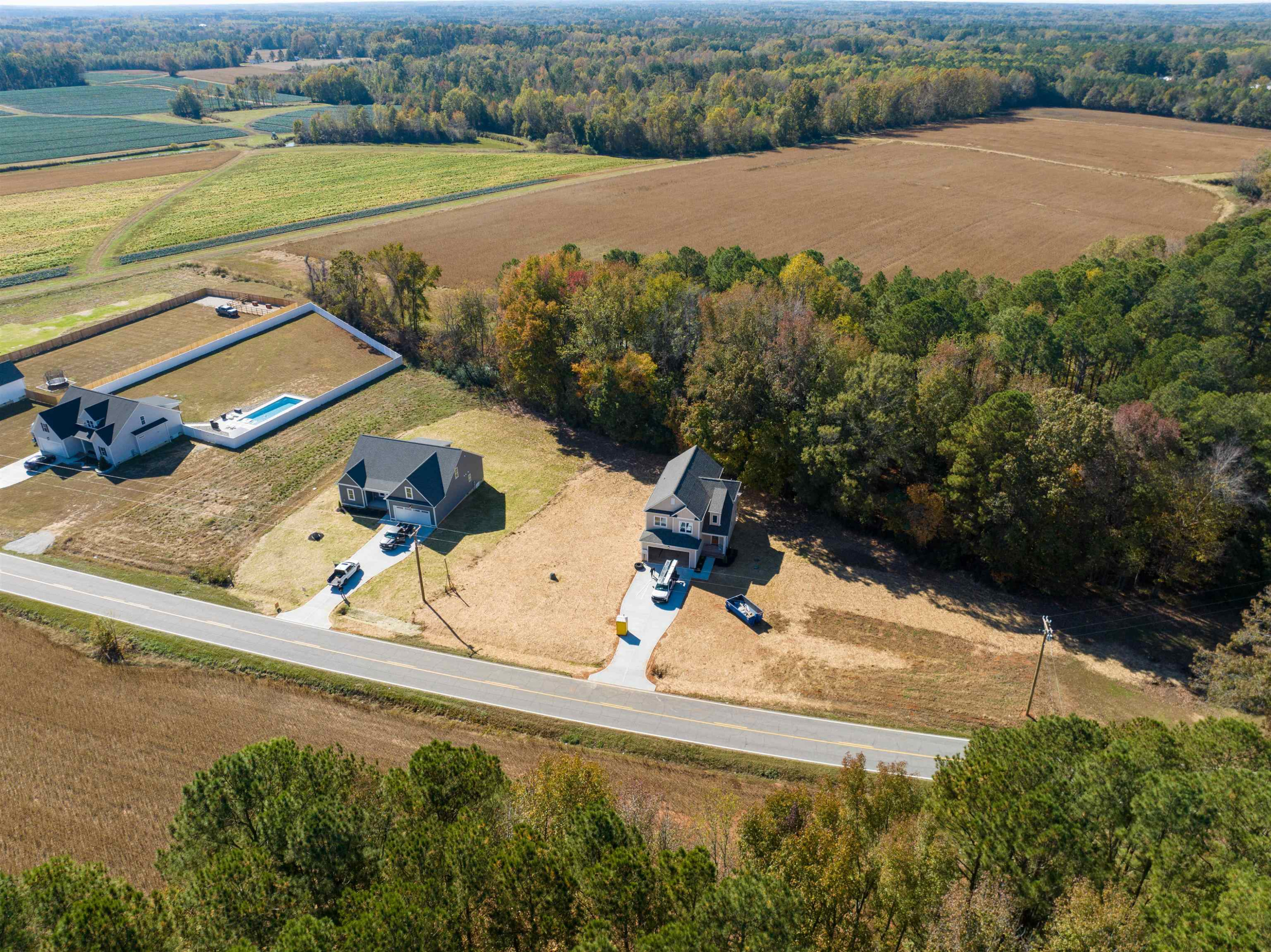 5080 Frazier Road Middlesex, NC 27557 - Photo 34 of 39 an aerial view of a house with a garden and lake view