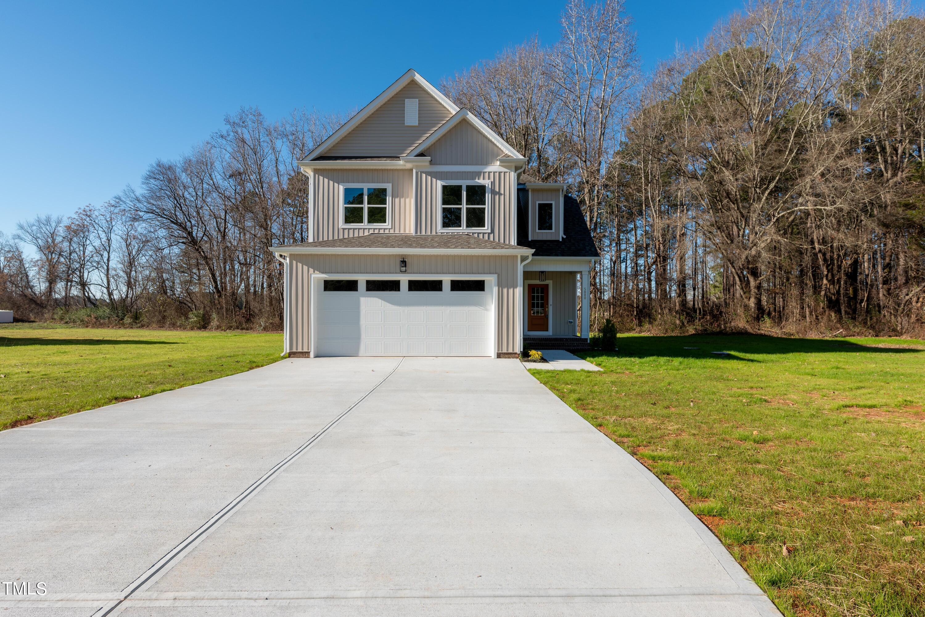 5080 Frazier Road Middlesex, NC 27557 - Photo 8 of 39 a front view of a house with a yard