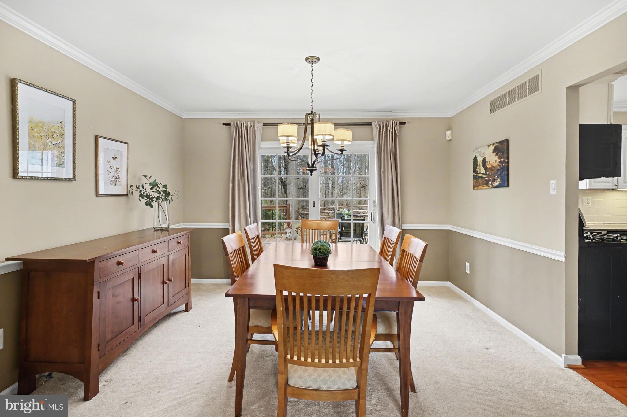 219 Twining Road Lansdale, PA 19446 - Photo 11 of 39 a dining room with furniture a chandelier and wooden floor